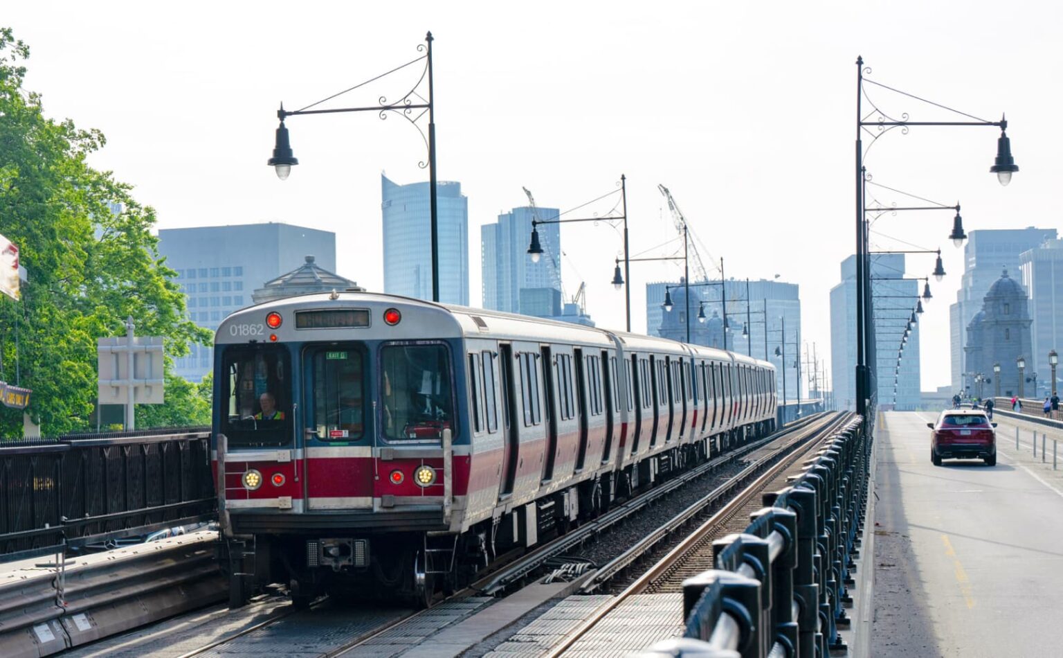 A red subway car, better known as the "T," pulls into a terminal in Cambridge MA.